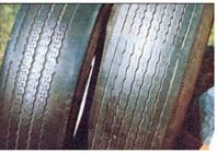 The wear bands (which show here as "breaks" in the tread grooves) on these two tires fairly scream that there are very few good miles left in this rubber.